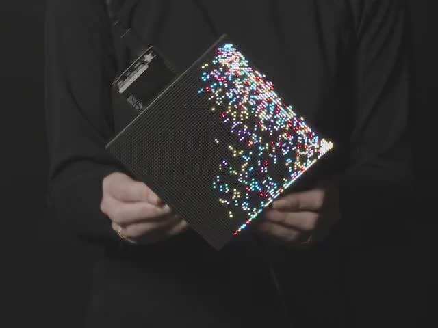64x64 RGB LED Matrix Panel - 2mm Pitch - Video of a person rotating an LED matrix. The animation resembles falling colored sand.