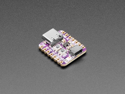 Adafruit QT Py ESP32-C3 WiFi Dev Board with STEMMA QT - Angled shot of an Adafruit QT Py ESP32-C3 WiFi Dev Board with STEMMA QT.
