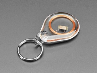 Angled with of a clear keychain fob with an RFID/NFC NTAG203 tag inside.