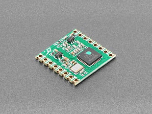 Angled shot of green LoRa radio module.