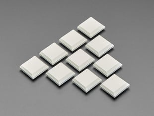 Angled shot of ten milky CHOC keycaps.