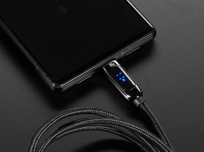 USB C to USB C Cable w/ 100W Watt Display - 1 meter Black Woven - Demo of coiled black woven USB A to USB C cable connected to a phone and charging.