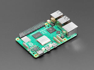 Angled shot of green Raspberry Pi 5 microcontroller.