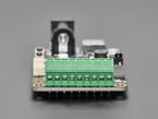 Close-up of green terminal blocks on LED driver board.