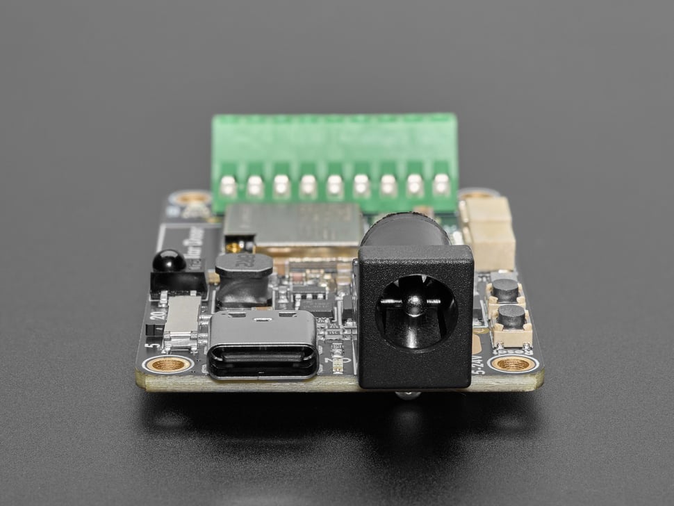 Close-up of USB-C connector and DC barrel jack on LED driver board.