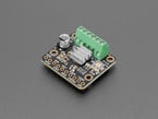 Angled shot of stepper motor driver board with silver, 4-fin heatsink.