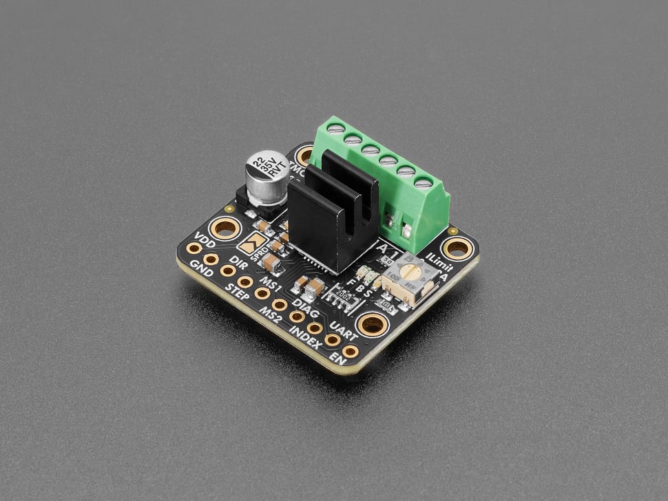 Angled shot of stepper motor driver board with black, 3-fin heatsink.