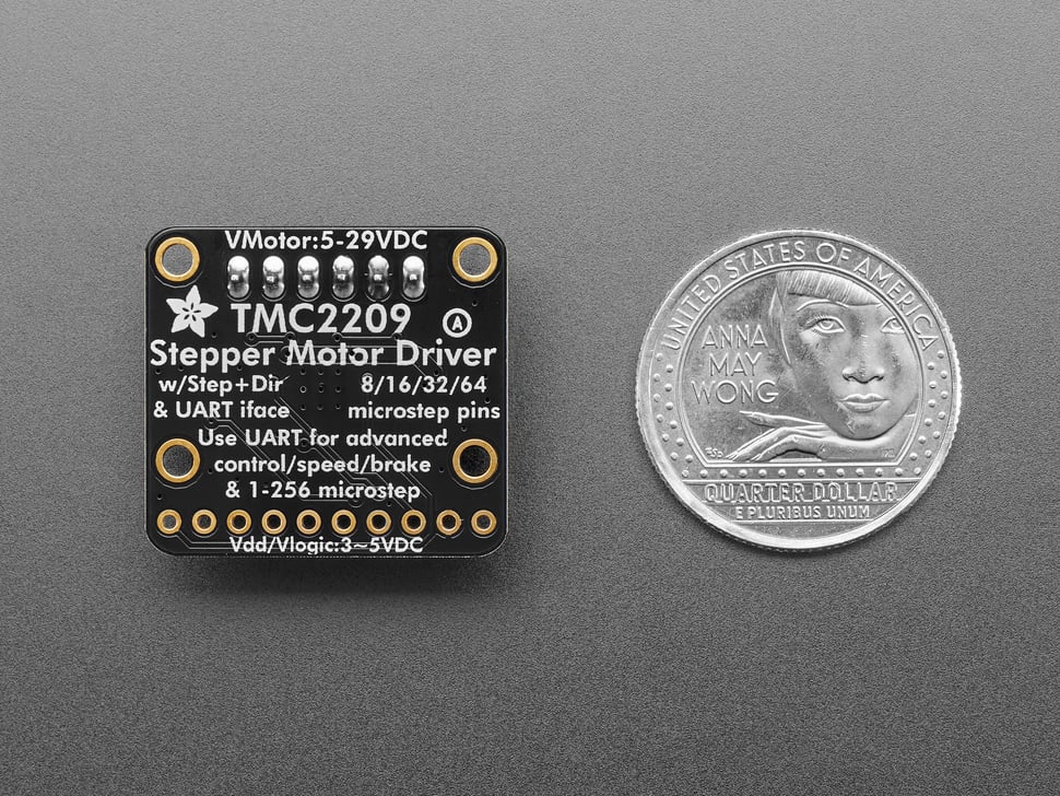 Back of square-shaped stepper motor driver breakout next to US quarter for scale.
