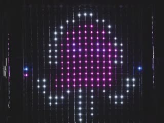 Video of LED netting emitting a space invader toon.