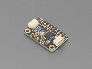 Angled shot of black, rectangular DAC breakout board.