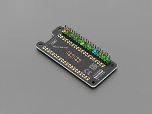 Angled shot of black, rectangular PCB with color-coded header.