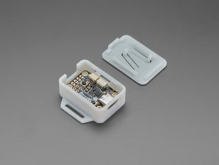 Angled shot of two-piece white plastic enclosure with LED driver board inside.