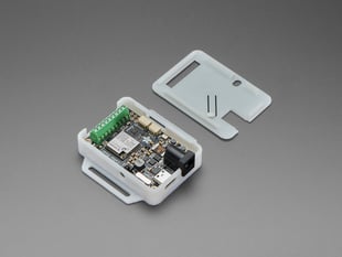 Angled shot of LED driver board in half-assembled enclosure.