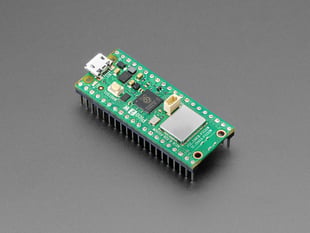 Angled shot of green, rectangular microcontroller with headers.