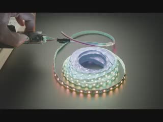 Video of a Black hand turning an LED reel on and off with a driver board.