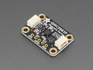 Angled shot of small, black, rectangle-shaped magnetic sensor breakout board.