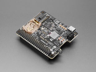 Angled shot of black, square, power management add-on board.