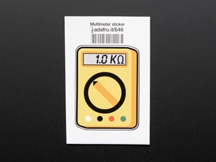 Rectangular sticker in the shape of yellow multimeter with dial, and a grey screen reading 1.0 kilohms. Mounted on white paper with barcode. 