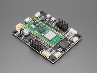 Angled shot of motor driver breakout board with Raspberry Pi Pico 2 W computer.