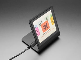 Angled shot of touchscreen with built-in stand, powered on with menu.