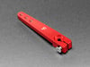 Angled shot of red, metal, servo arm.