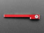 Angled shot of red, metal, servo arm on its side