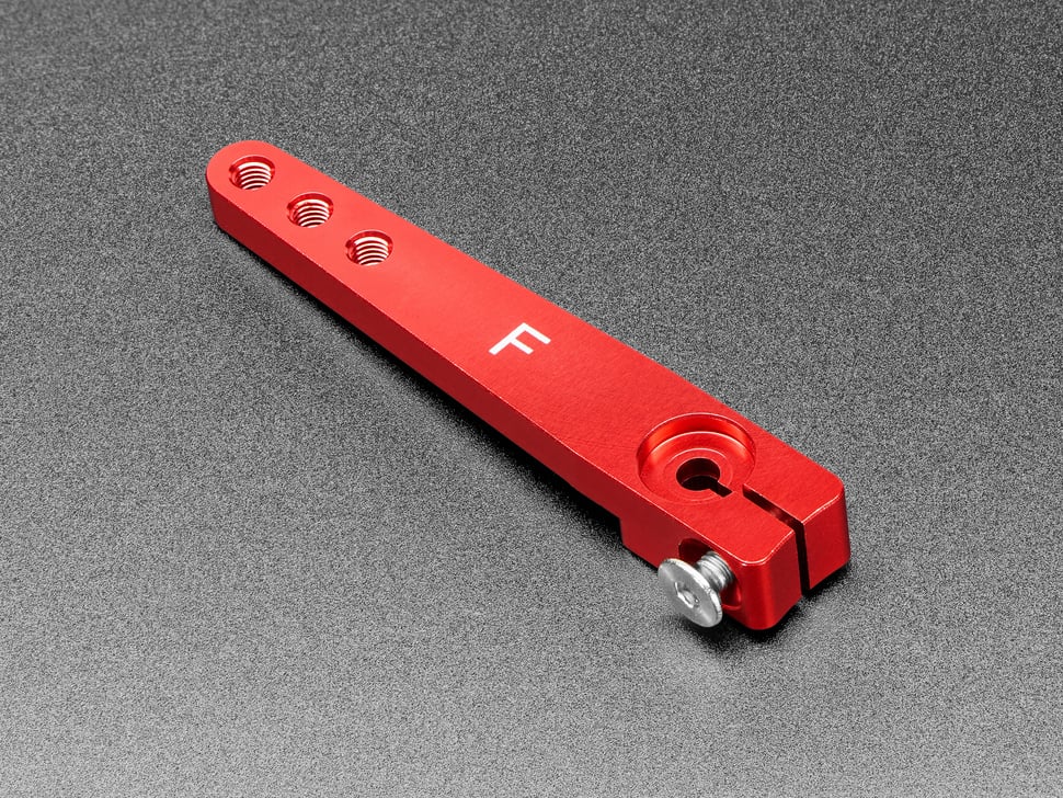 Angled shot of red, metal, servo arm.