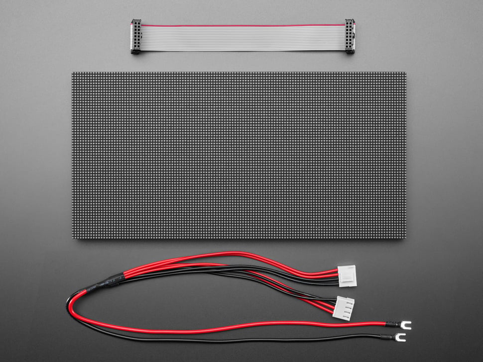 Overhead shot of LED matrix panel, IDC cable, and power cables.