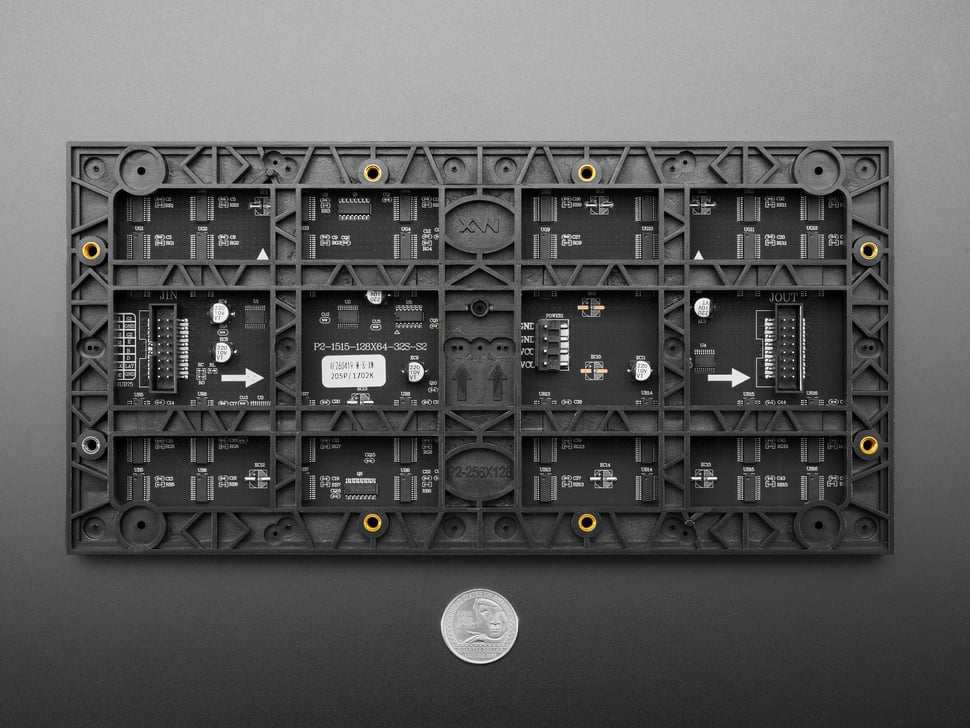 Back of LED matrix panel with U.S. quarter for scale.