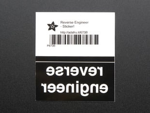 Black rectangular sticker with the backwards lettering REVERSE ENGINEER in white. Mounted on white paper with barcode