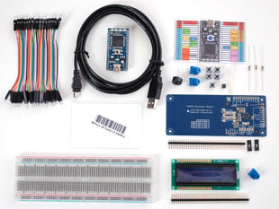 Kit contents with mbed, RFID reader, breadboard, LCD, wires and components