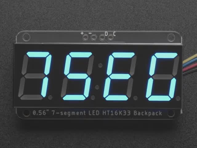 Adafruit 0.56" 4-Digit 7-Segment Display w/ I2C Backpack - Blue - STEMMA QT / qwiic - Blue 7-segment clock display soldered to backpack with all segments lit