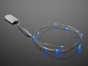 Coil of thin flexible wire with lit up embedded blue LED 'fairy' lights attached to battery holder