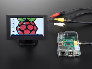 Mini enclosed TFT Television wired up to Raspberry Pi, showing off desktop screen.